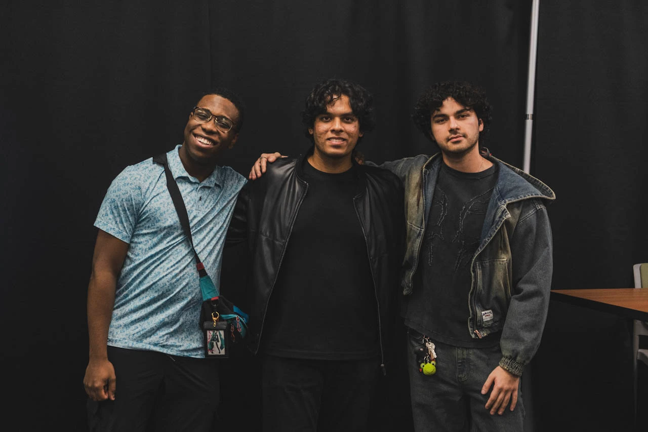 Three XR Club members together at an event.