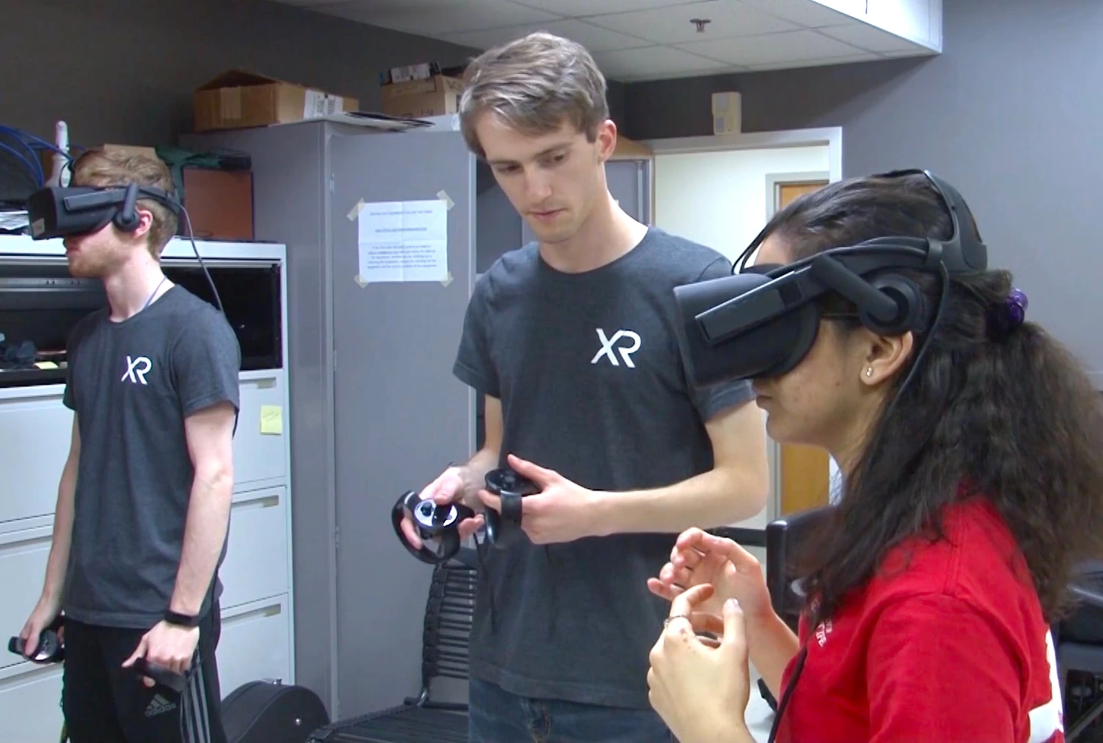 XR Club members sharing VR headsets in an earlier club lab.