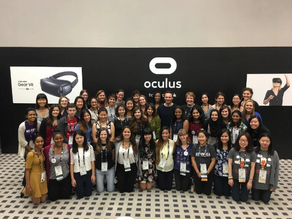 A group of event attendees at the Oculus booth.