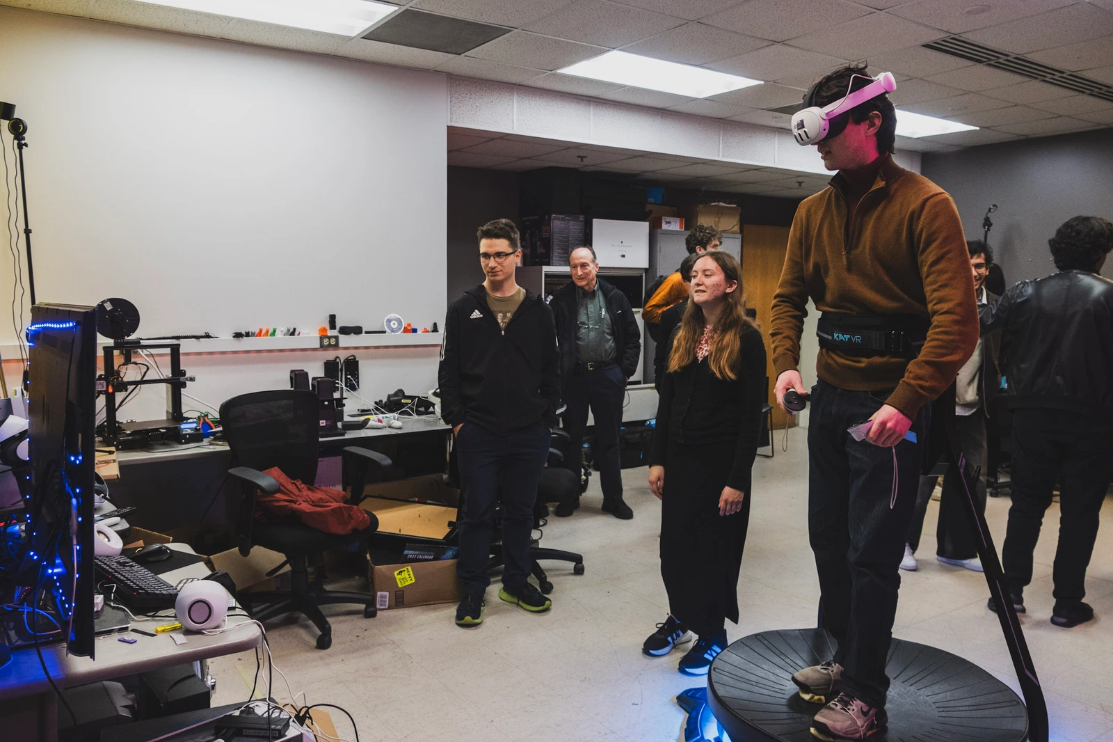 A student trying the VR treadmill during a lab demonstration.